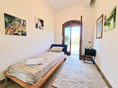 a bedroom with a bed in a room at Villa Giacoma hot tub and garden in Mandra Capreria
