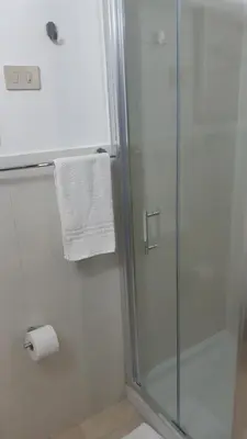 a bathroom with a shower and a toilet paper roll at Borgo Vivo in Palermo