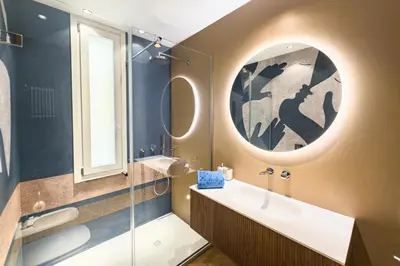 a bathroom with a sink and a mirror at Exclusuite Design Apartment in Palermo