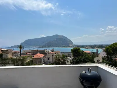 a view of the water from a balcony at MondHello a 2 passi dal mare in Palermo