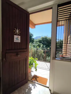 a door leading to a balcony with a view at Azzurra Apartment Mondello - Casa Vacanza a due passi dal Mare in Palermo