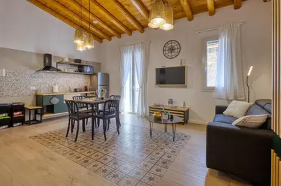 a living room with a couch and a table at VFH La Rada Apartments in Santa Flavia