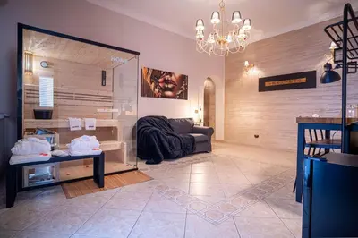 a living room with a couch and a large mirror at Suite del Corso in Ficarazzi