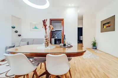 a dining room with a table and white chairs at Sofia's House - Comfort e Relax vicino Stazione Notarbartolo in Palermo