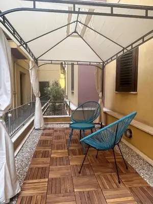 a balcony with two chairs and a table at Casa Didi - Cattedrale in Palermo