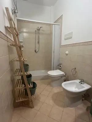 a bathroom with a toilet sink and a shower at Casa Didi - Cattedrale in Palermo