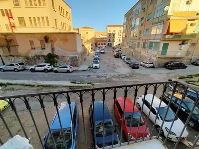 a view of a parking lot with parked cars at Casa Marite' in Palermo