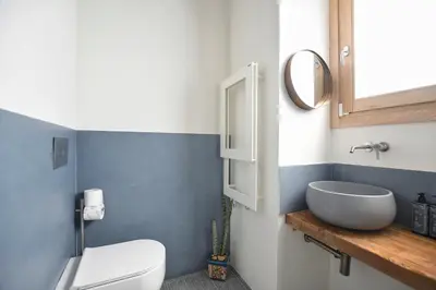 a bathroom with a white toilet and a sink at iFlat Casa di Design nella piazzetta in Palermo