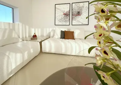 a living room with a white couch and a glass table at Solemar Sicilia - Villa Gloria in Ficarazzi