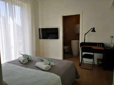 a bedroom with a bed with towels on it at Cielo D'Alcamo Palazzo Mazzini in Alcamo