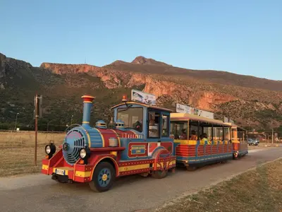 a small train with people riding on it at Casa Oltremare UnmarediBlu in San Vito lo Capo