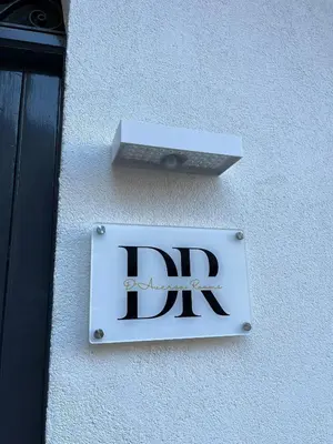 a sign on the side of a building at D'Aversa Rooms in Marineo