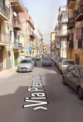 a street with cars parked on the road at Monreale Prestige Rooms B&B in Monreale