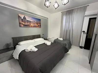 a hotel room with two beds with white towels at D'Aversa Rooms in Marineo