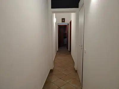 a hallway with white walls and a hallway with at Le Case di Sole San Vito Lo Capo in San Vito lo Capo