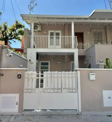 a house with a white fence in front of it at Ciuri D'Amuri in Palermo