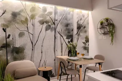 a dining room with a wall mural of a tree at Holivù Apartments in Palermo