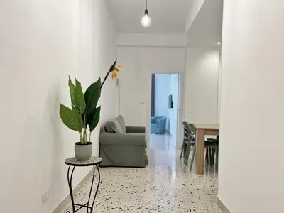 a living room with a couch and a table at Palermo central stay in Palermo