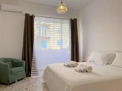 a bedroom with a bed with two towels on it at Palermo central stay in Palermo