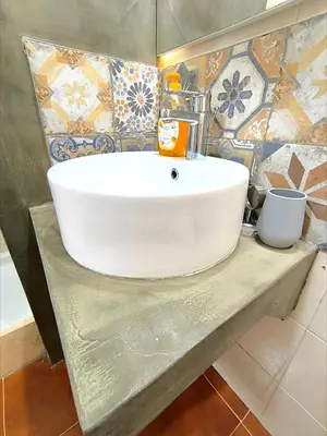 a white sink on a counter in a bathroom at Dimora Filangeri in Santa Flavia