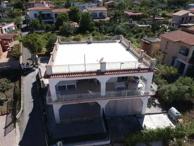 an aerial view of a house with a swimming pool at I Piani Apartment in Trabia