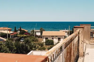 a view of the ocean from a balcony at I Piani Apartment in Trabia