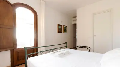 a bedroom with a bed and a window at Visitsicilia Villa Cialoma in Scopello