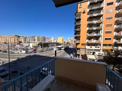 a balcony with a view of a street and buildings at Notarbartolo Casa Centrale in Palermo