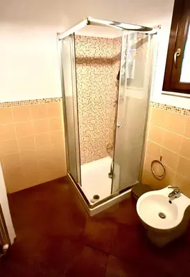 a bathroom with a shower and a toilet at La Casa di Cat in Palermo