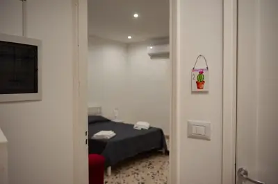 a room with a bed and a small room with a bed sidx sidx at Holiday House Annunziata 2 in Termini Imerese