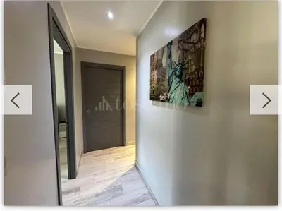 a hallway with two pictures on the wall at Casa Marta in Palermo