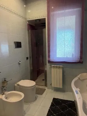 a bathroom with a toilet and a sink and a shower at Casaleoni5769 in Palermo