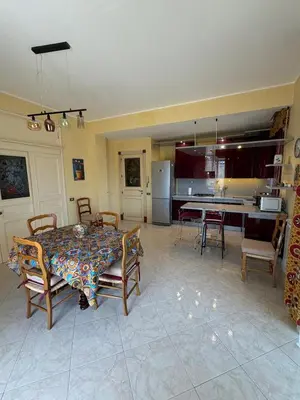 a kitchen and dining room with a table and chairs at Casaleoni5769 in Palermo