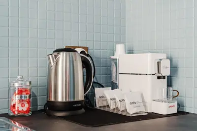 a coffee maker on a counter in a kitchen at BallarHòme 105 