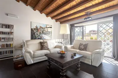 a living room with two white couches and a coffee table at The Urban Retreat - Relax in the Historic Center in Palermo