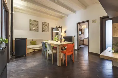 a kitchen and dining room with a table and chairs at Mama apt - Comfort & style in Partanna Mondello in Palermo