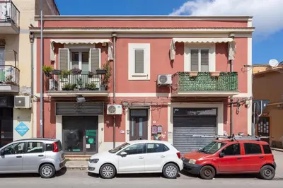 three cars parked in front of a building at Mama apt - Comfort & style in Partanna Mondello in Palermo