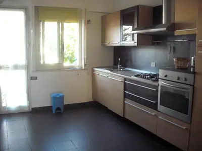 a kitchen with a sink and a stove top oven at Apartment in Villa a Mondello in Mondello