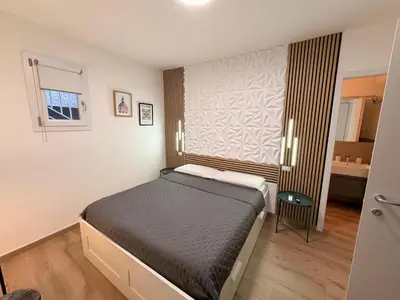 a small bedroom with a bed and a window at Dimora Santa Spina - La Terrazza in Palermo