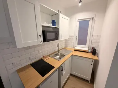 a small kitchen with a sink and a microwave at Dimora Santa Spina - La Terrazza in Palermo