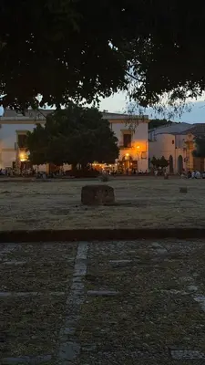 a large field with a building in the background at Epic terrace in Kalsa in Palermo