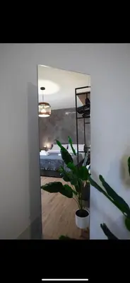 a potted plant in a room with a view of the ocean at Duomo View Apartment in Monreale
