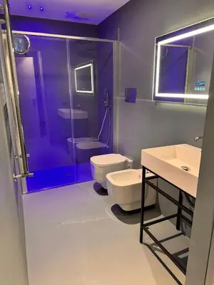 a bathroom with a toilet and a shower and a sink at Abracadabra Hidden Garden in Palermo