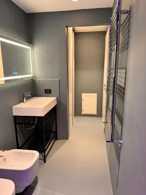 a bathroom with a sink and a toilet at Abracadabra Hidden Garden in Palermo