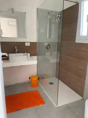 a bathroom with a shower and a sink at Mdue in Palermo
