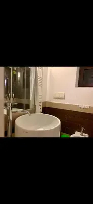 a bathroom with a white sink and a toilet at Al rifugio della stazione in Palermo
