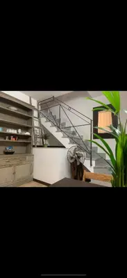 a staircase in a room with a stair case at Al rifugio della stazione in Palermo