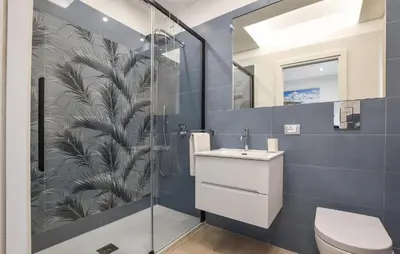 a bathroom with a toilet and a sink at Amazing Home In Trabia in Trabia