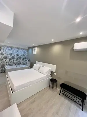 a bedroom with a white bed and a desk at Gianferrara 37 Comfort Rooms alla Cattedrale in Palermo