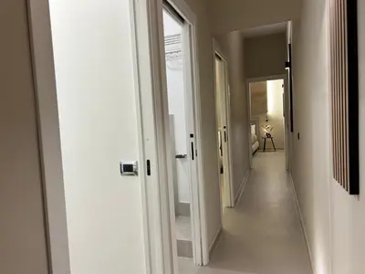 a hallway with a hallway leading to a room with at Vulpi 29 Apartment-Deluxe in Palermo